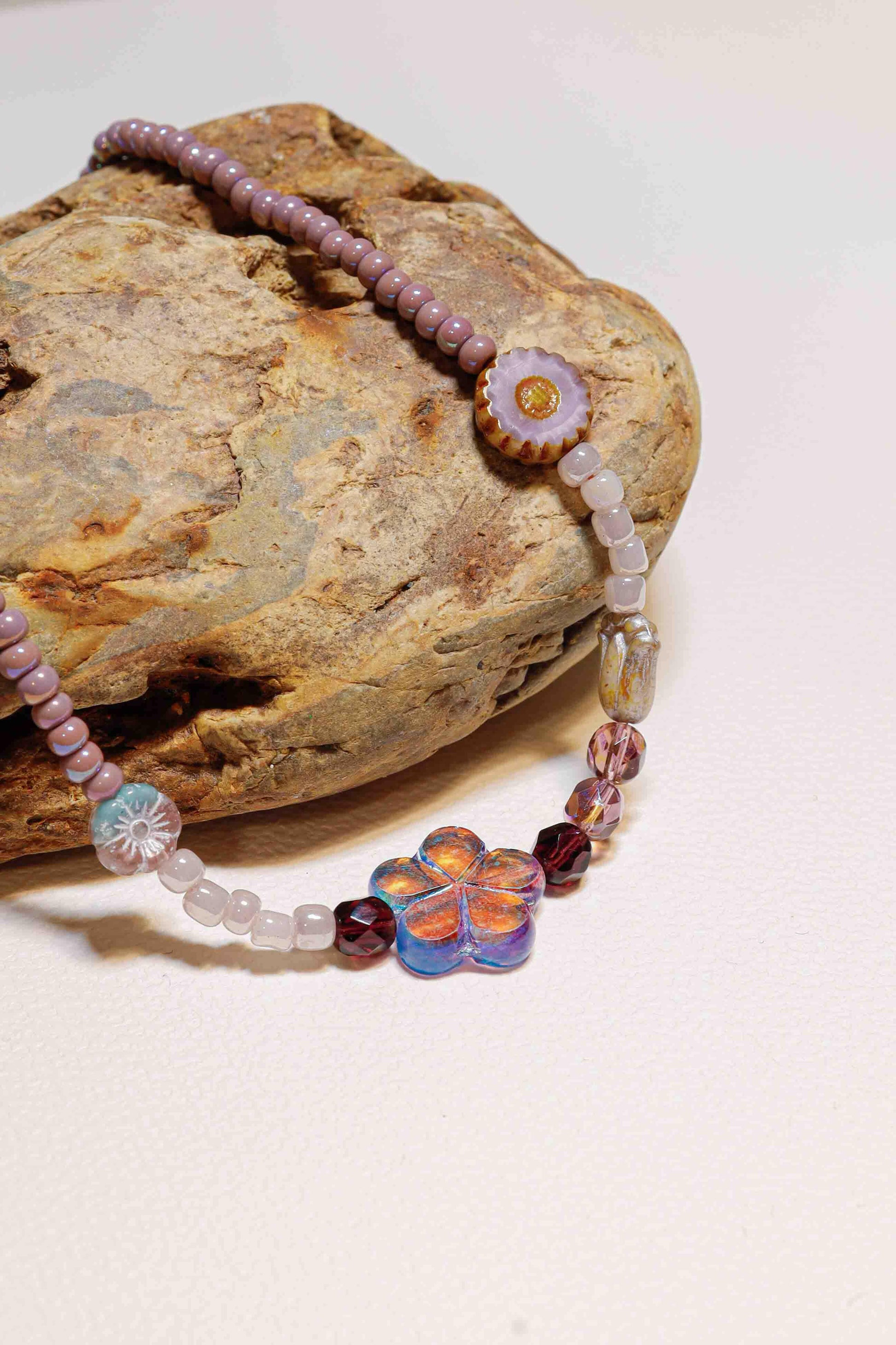 vintage handmade purple floral ripples bead choker on stone